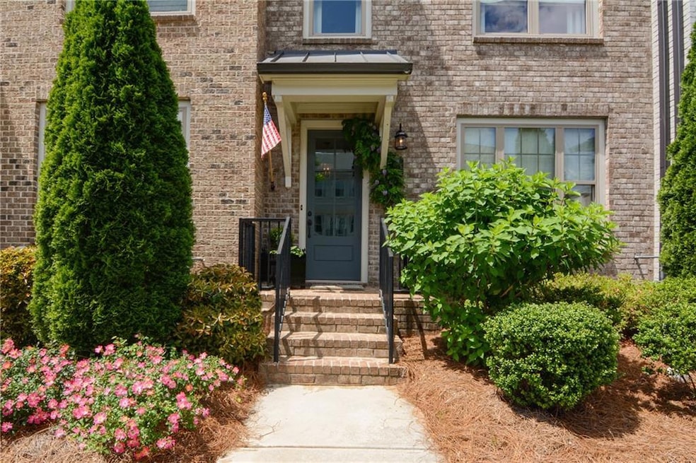 Entrance to property featuring brick siding