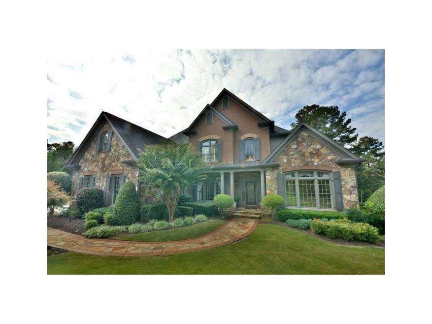 Exterior Front. Custom brick and high-end stone ho