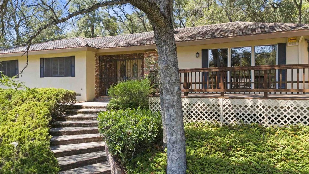 Ranch-style home featuring a wooden deck