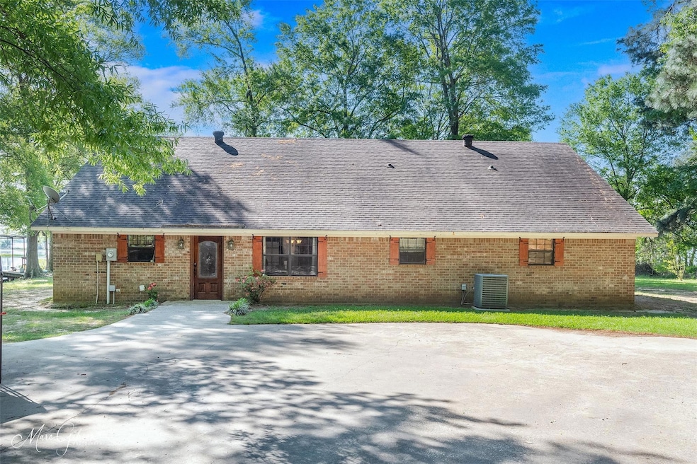 View of front of house featuring roof with shingle