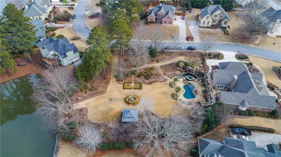 This stately 4 sides brick and stone, lake front h