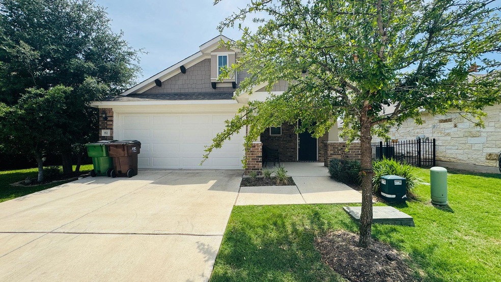 Craftsman-style home with brick siding, concrete 