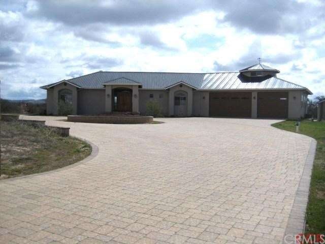 Beautiful home with a cobblestone circular drivewa