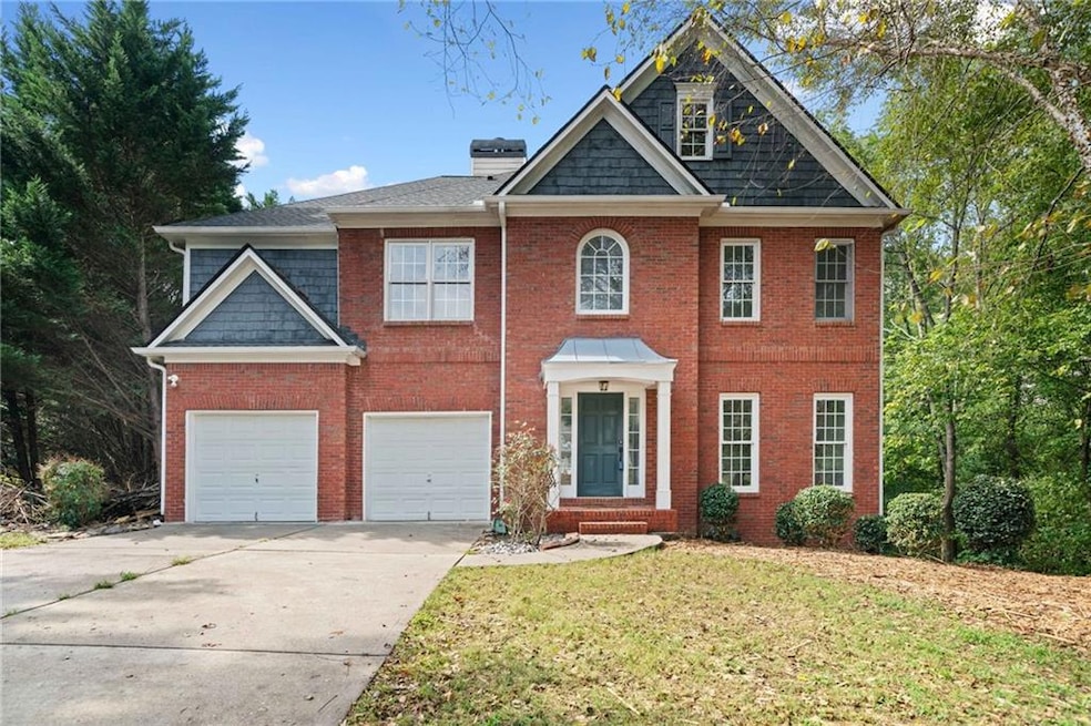 View of front of property with a garage and a fron