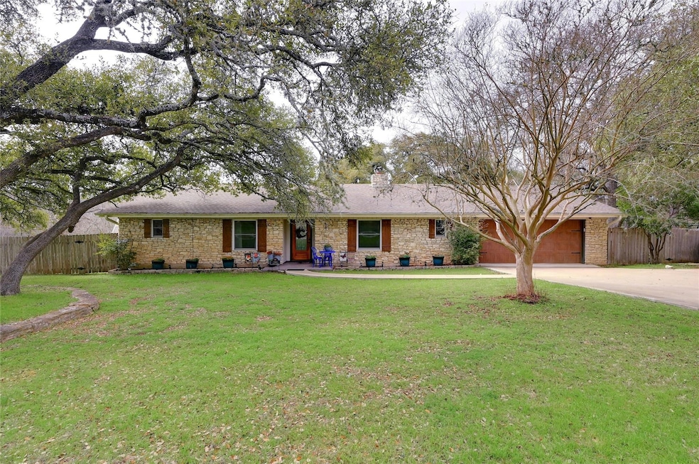 Single story home featuring concrete driveway, a 