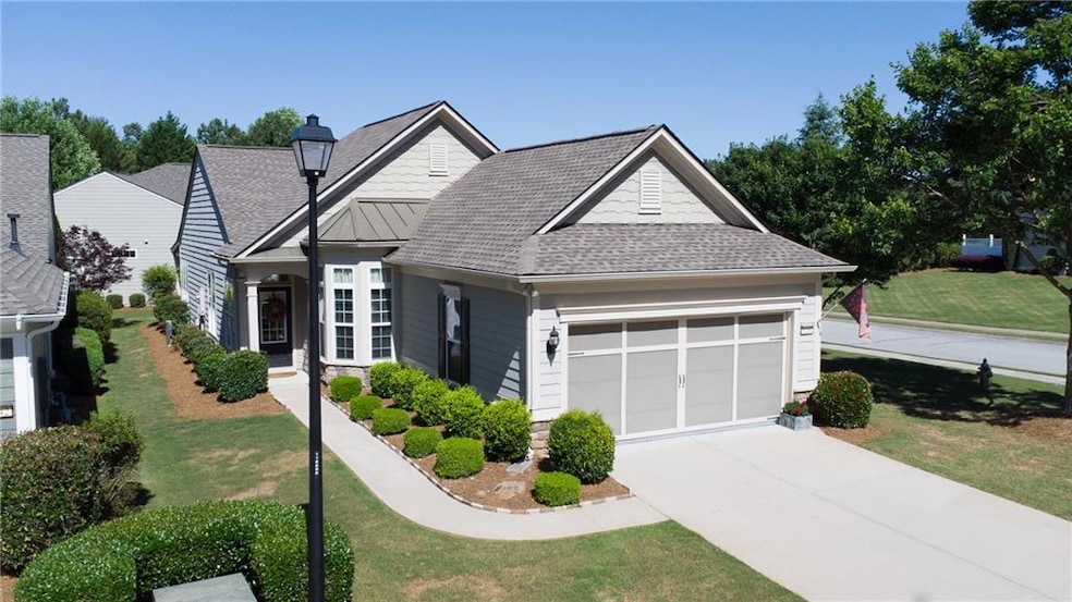 View of front of house with garage and landscaped 