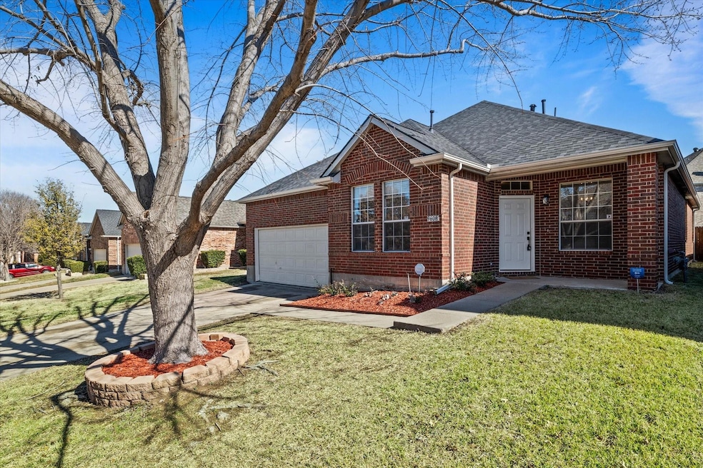 View of front of home featuring a garage and a fro