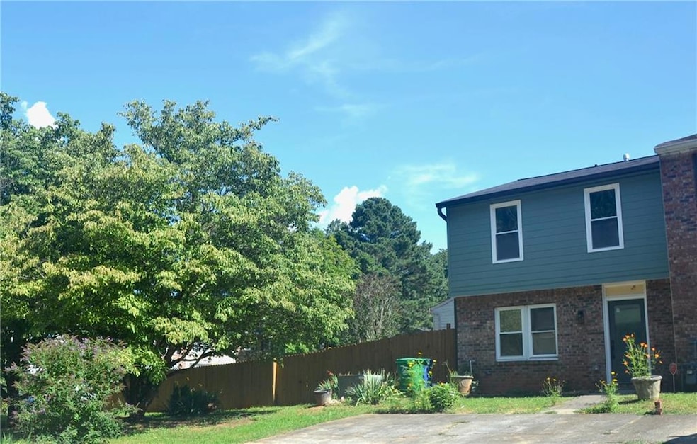 End unit with large, fenced, private yard.