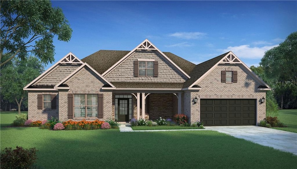 Craftsman-style house with a front lawn, concrete driveway, and brick siding