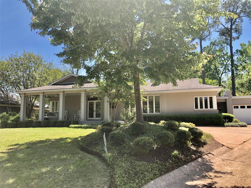 View of front of property with a front yard