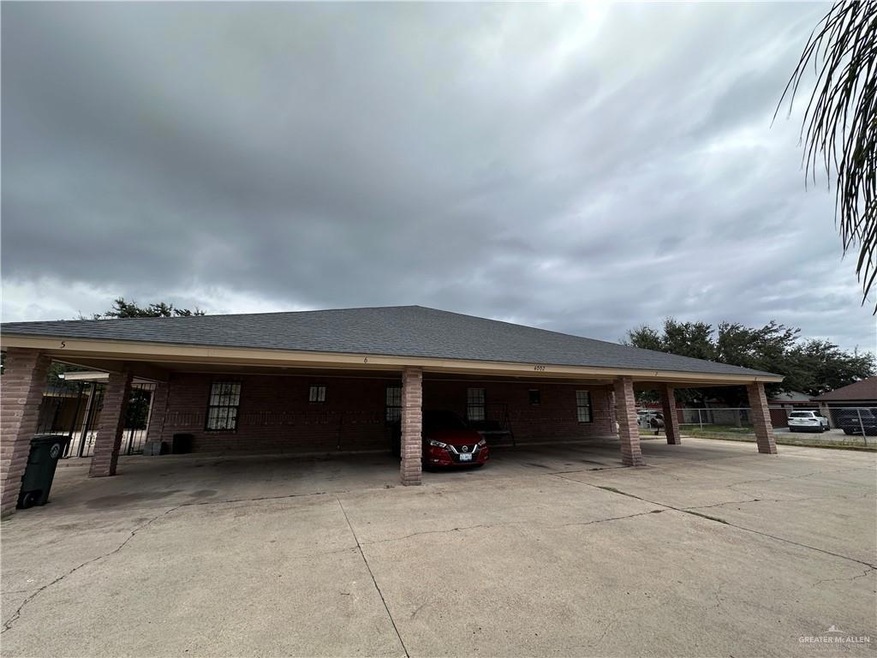 View of side of home with a carport