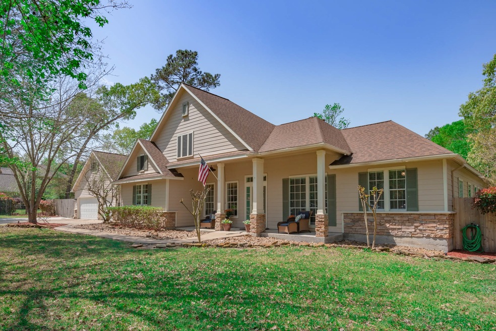 Welcome to 26711 Stagecoach Crossing! Curb appeal abounds with the welcoming front porch and stone façade.