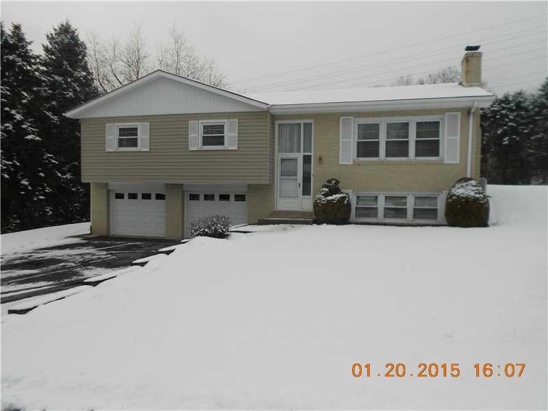 Exterior Front. Solid brick and vinyl split entry 