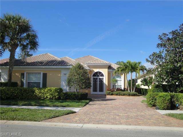 Entrance to property with paver brick driveway and