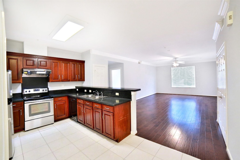a spacious open-concept kitchen and living area. T