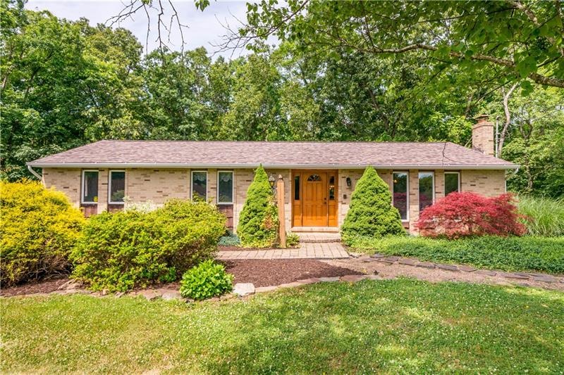 Welcome home to this beautiful brick, custom ranch