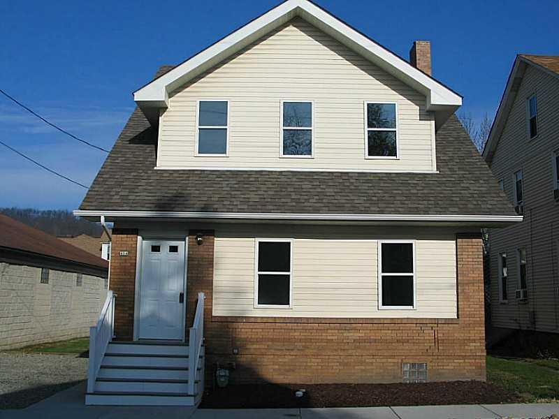Exterior Front. New stairs and concrete sidewalk