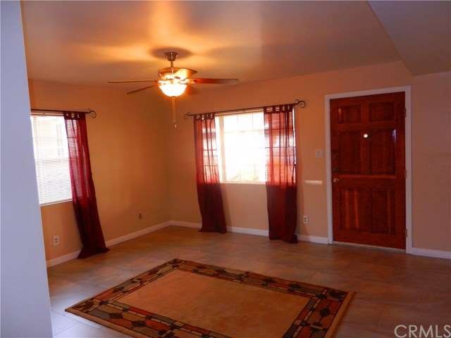 remodeled living room with new tile and widow trea