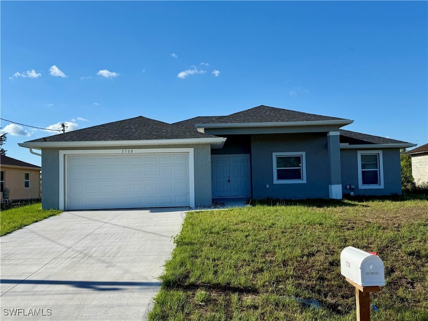 View of front of home featuring stucco siding, con