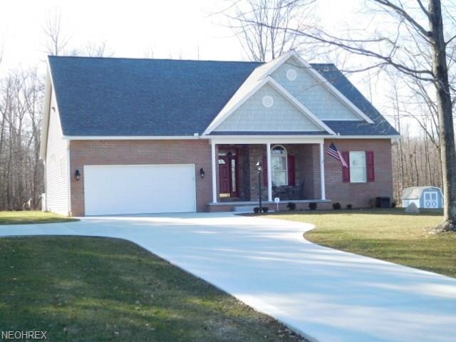 Beautiful custom built ranch on one acre surrounde