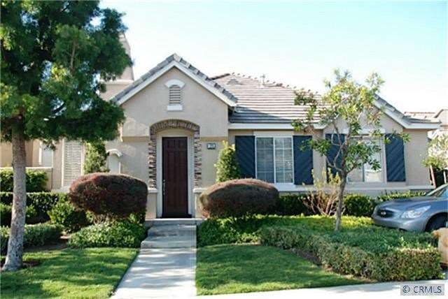 Excellent curb appeal in this cottage style gated 