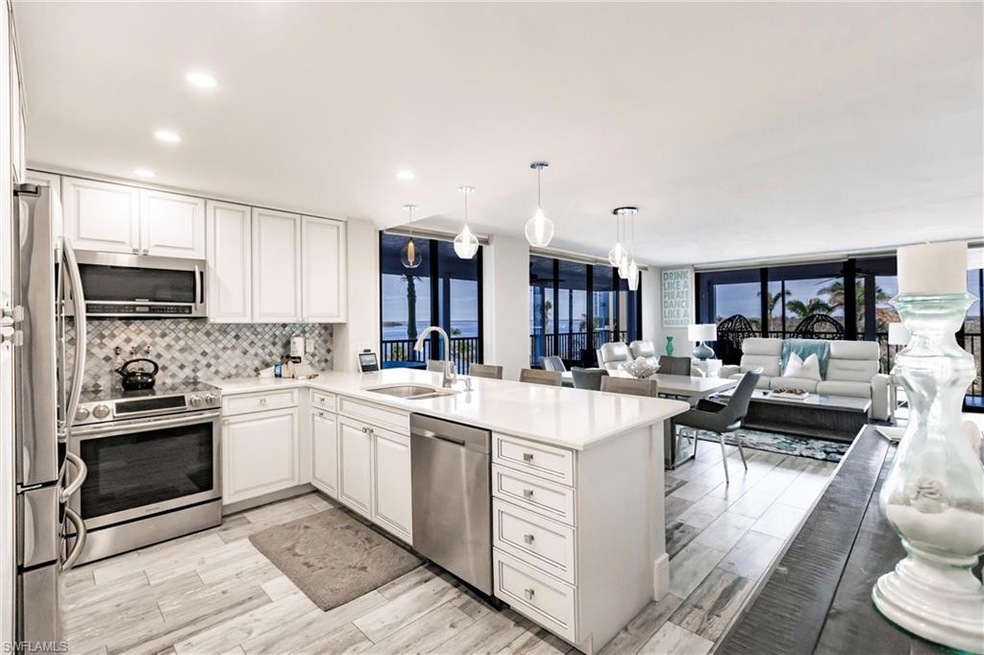 Kitchen with sink, kitchen peninsula, hanging ligh