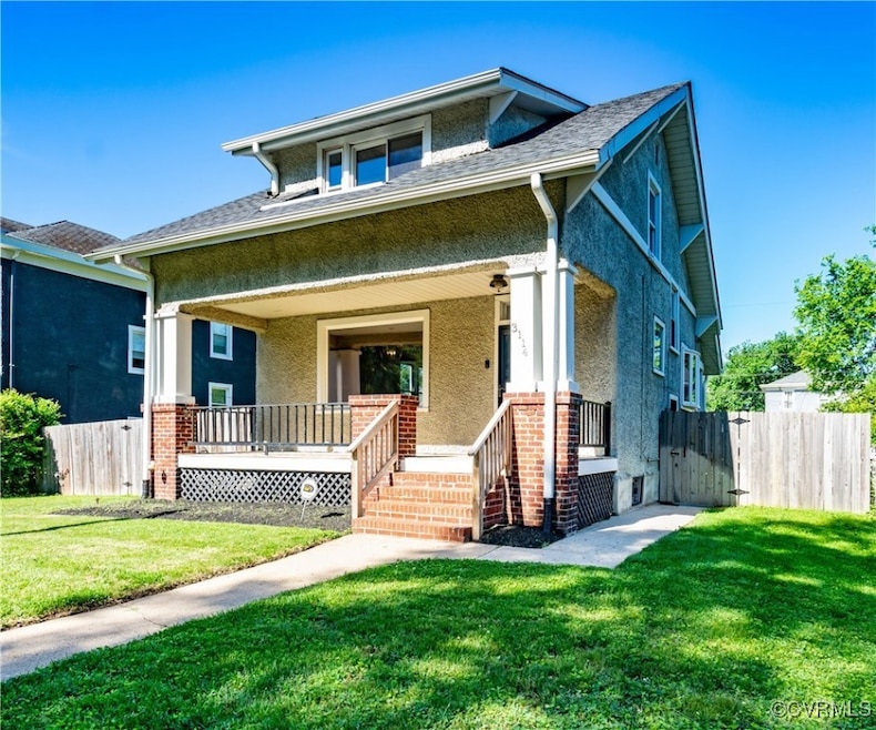 Front/side view of property with stucco siding and