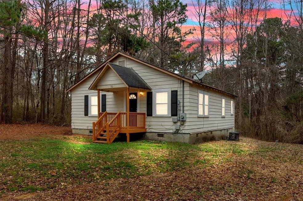 Bungalow-style home with a yard