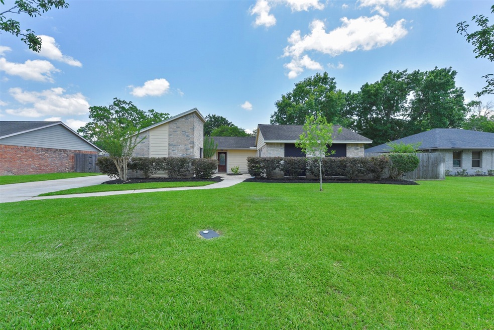 Welcome to 1016 West Castlewood Avenue in Friendswood's established Wilderness Trails community! This single story 3 bedroom home boasts a lush yard with freshly mulched landscaping, a quaint courtyard, and a brick and Hardie-Plank elevation.