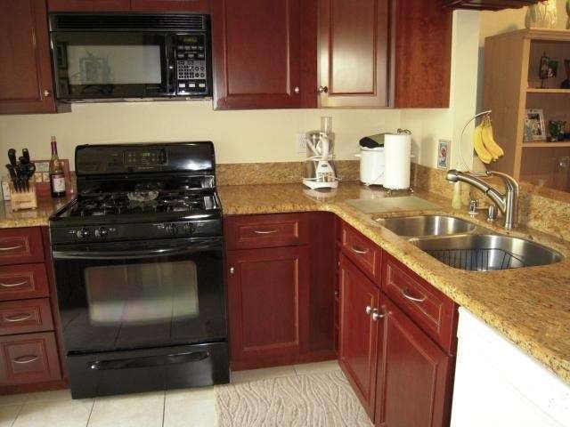 This remodeled home features a kitchen with granit