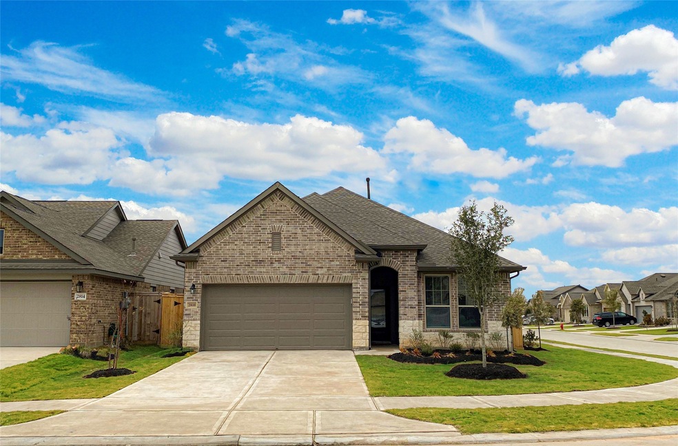 Gorgeous brick & stone 1-story 3-bedroom home with home office/study in the highly sough-after community of Jordan Ranch