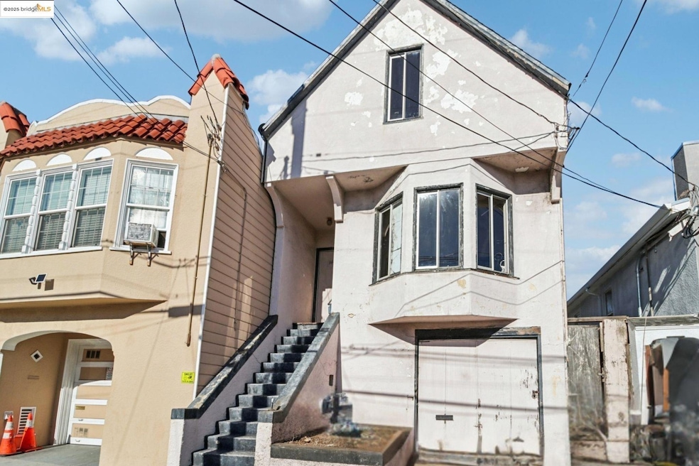 View of home's exterior with stairs, stucco siding, and a tiled roof