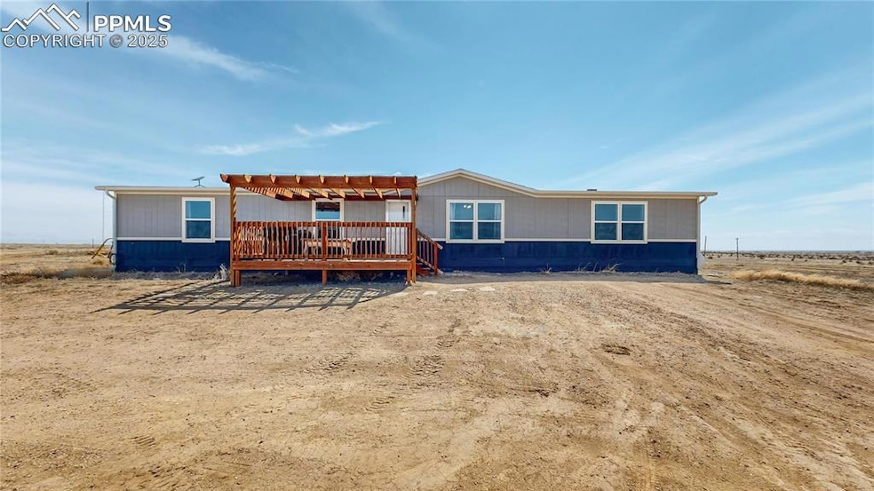 View of front featuring a pergola and a deck to en
