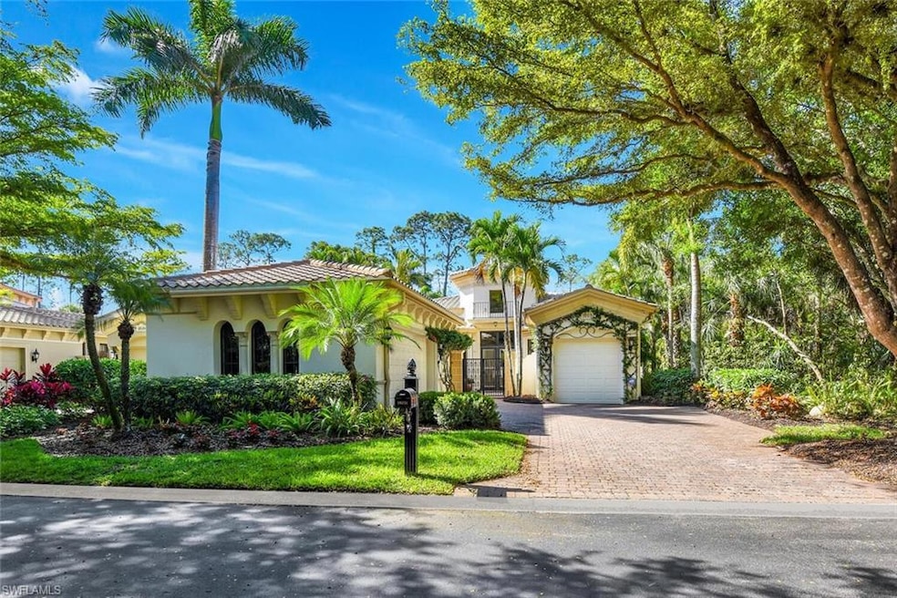 Mediterranean / spanish-style home with an attache