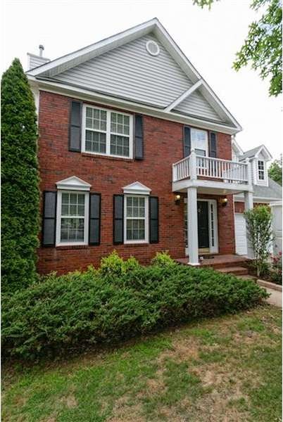 Classic 4 bedroom, 2.5 bathroom brick home located