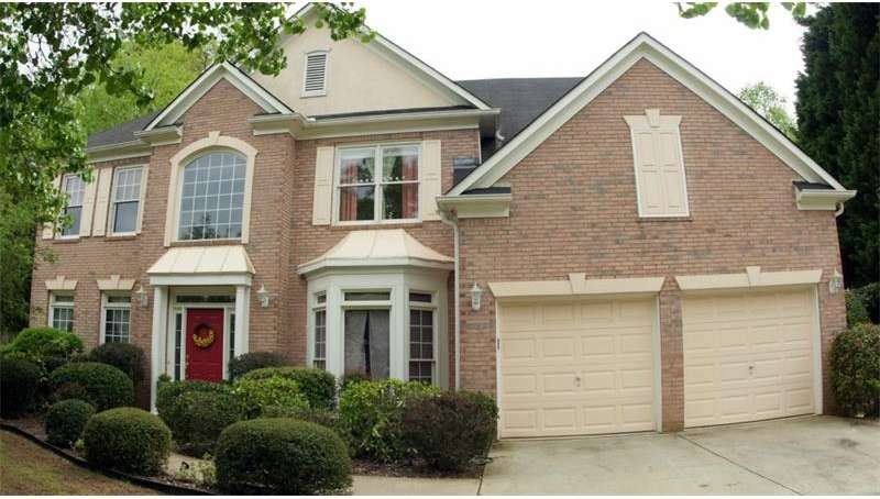 Beautiful brick front with professionally landscap