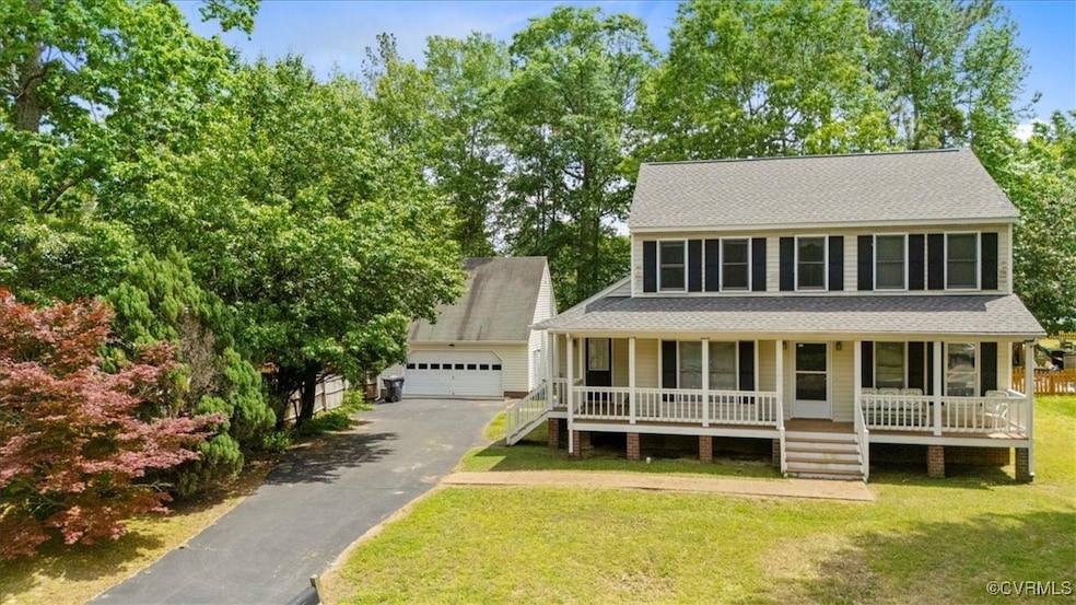 Colonial-style house with covered porch, roof with