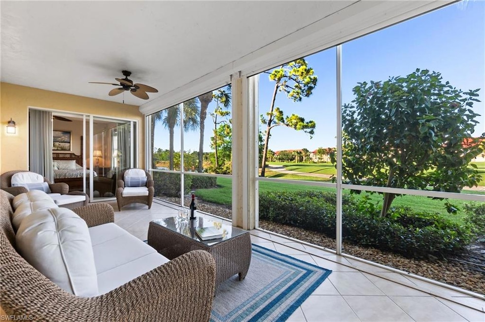 Sunroom with ceiling fan, tile patterned flooring, outdoor lounge area, and view of golf course