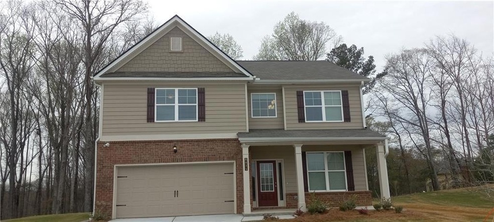 Craftsman-style house with an attached garage, a s