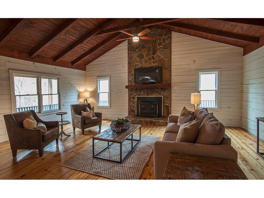 Gorgeous Living Room with Handsome Rocked Fireplac