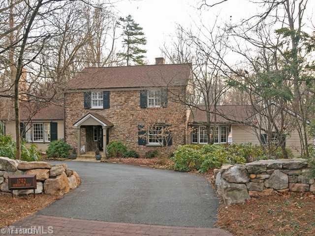Exterior Front. Front Exterior with stone walls and circular drive