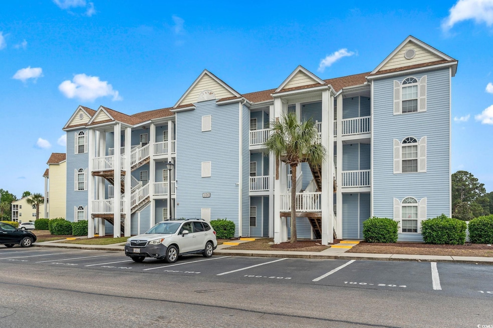 View of property with uncovered parking