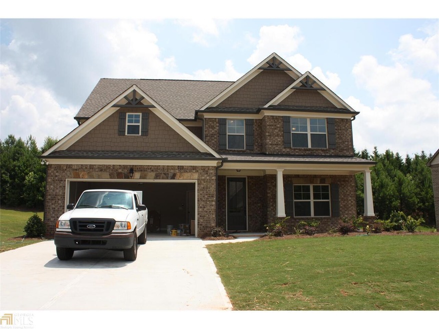Front of home features a brick/stone exterior and 