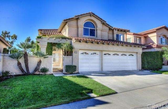 Mediterranean charmer nestled on a quiet, tree-lin