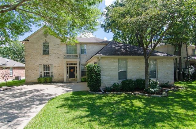 Lovely white stone home in popular Bent Tree Subdi