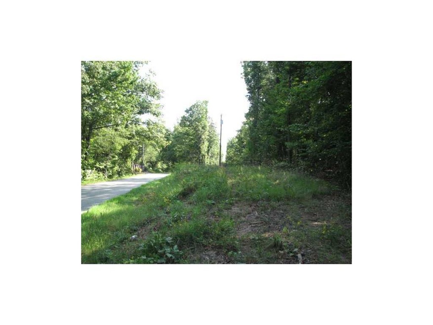 Exterior Front. Paved county road along the proper