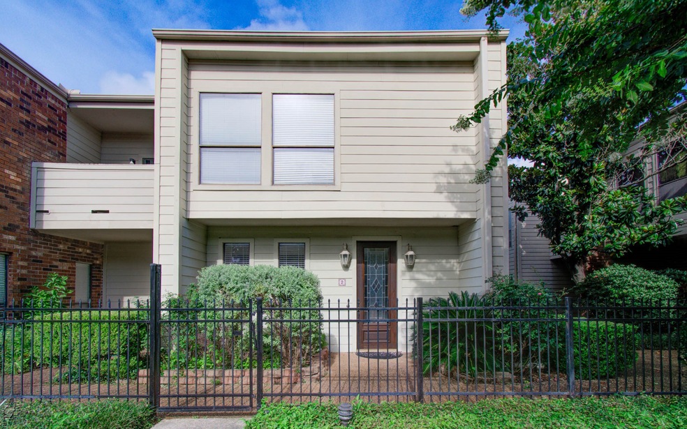 Charming townhouse featuring a welcoming facade an