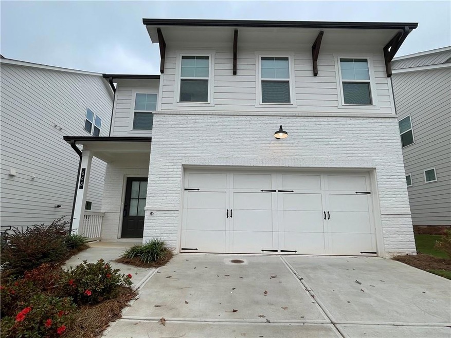 View of front of property featuring a garage
