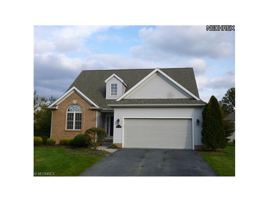 Front of condo. Two car garage and driveway.