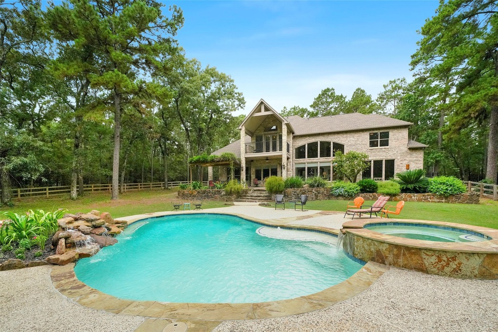 Custom 4800 sq ft home located on a beautiful/private 5 acre lot! Property features a swimming pool with spa, & waterfall, large covered outdoor pavilion with built-in kitchen, and tons of covered porch area off the back of the house to enjoy the views of the land. In addition there is also a 50'x30' metal insulated shop on a slab that has water, power!